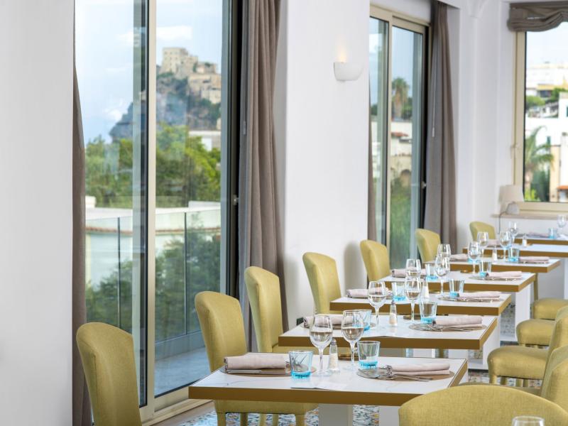 Elegant restaurant with castle view, modern and bright decor.